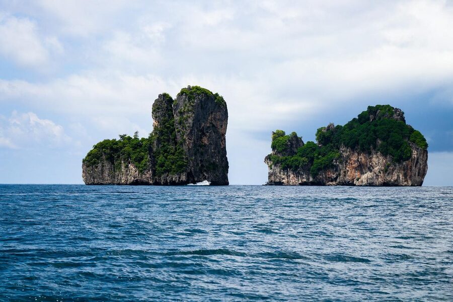 Majestic green limestone islands rising from the Thai sea