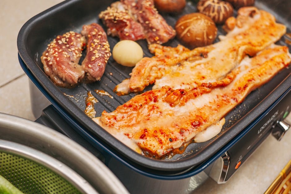 Korean BBQ pork belly and beef on grill