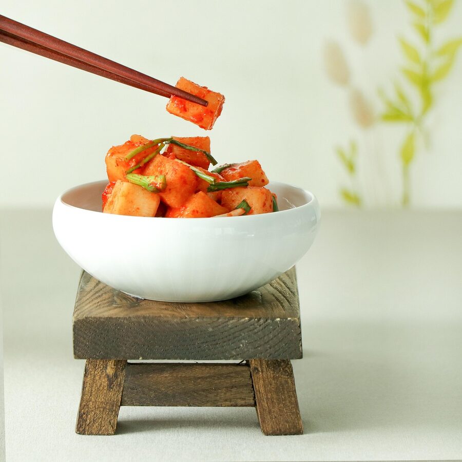 Close-up of Korean kkakdugi radish kimchi with red paste
