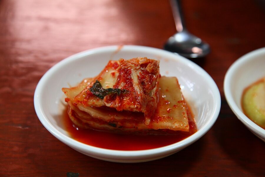 Spicy Korean baechu cabbage kimchi with red chilli flakes