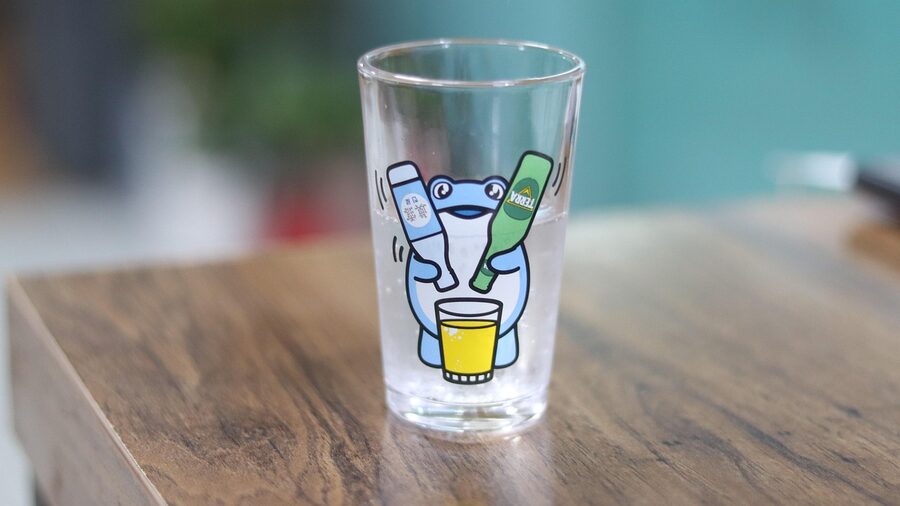 Pouring soju into a small Korean shot glass