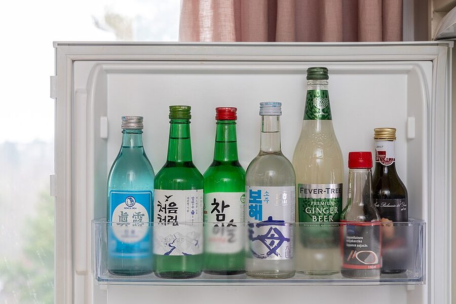 Assortment of Korean soju brands in a convenience store fridge