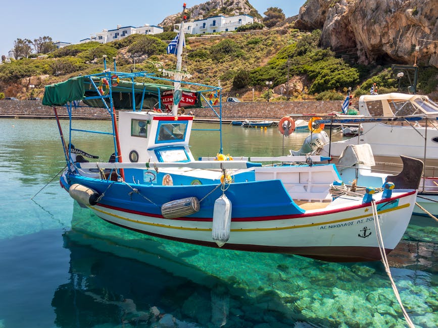 Traditional Greek fishing boat clear water harbor