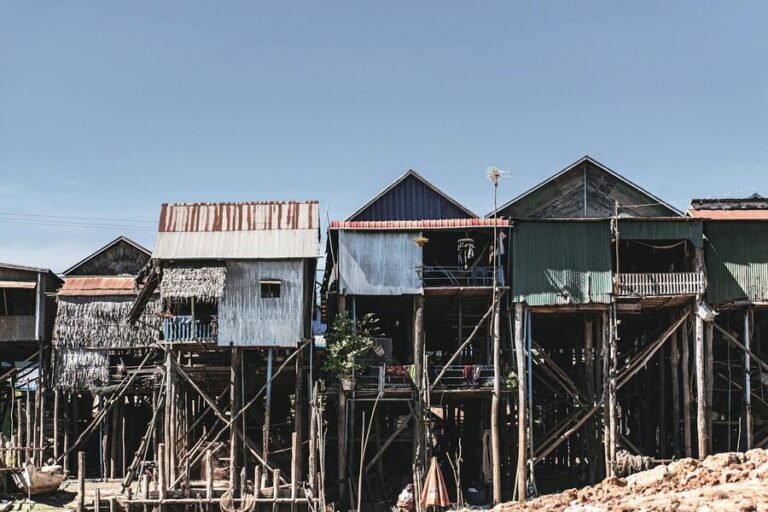 Towering stilt houses of Kampong Phluk rising above dry ground in the dry season