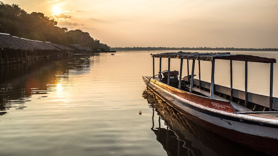 Wooden boat on the lake at sunset in Siem Reap Cambodia