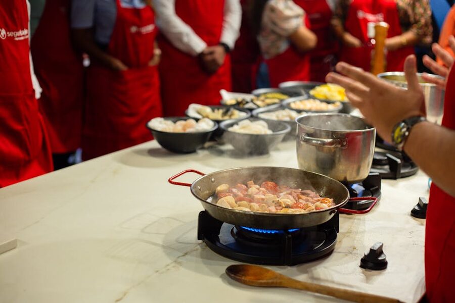 Students in a Kyoto cooking class learning together at a kitchen counter