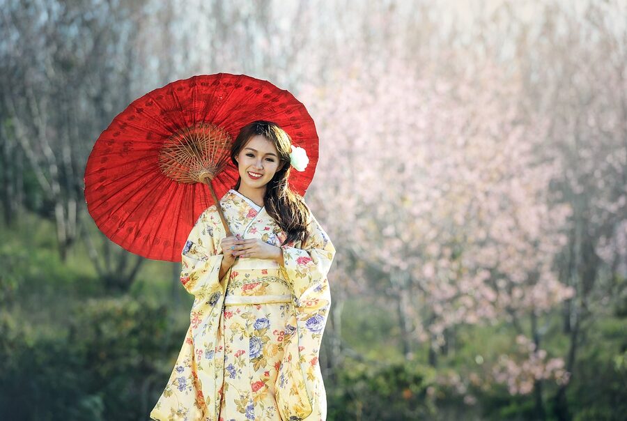 Geisha walking through street in Kyoto