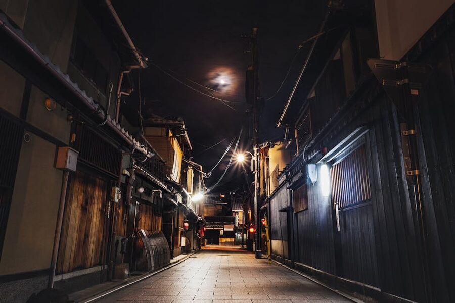 Kyoto nighttime alley with traditional wooden houses