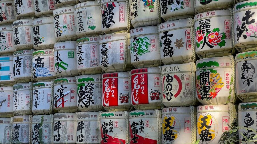 Decorative sake barrels displayed at a Japanese shrine
