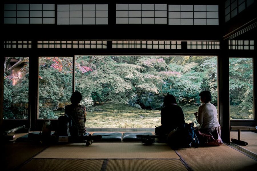 Traditional Japanese tea room with women seated on the floor