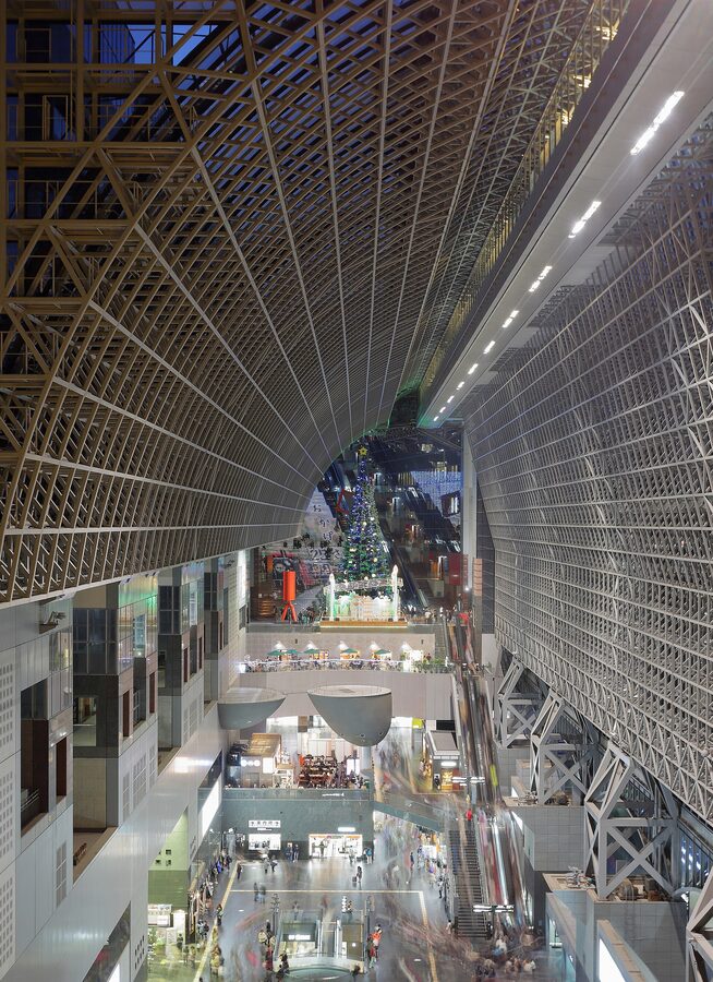 Kyoto Station main concourse at night with glass roof