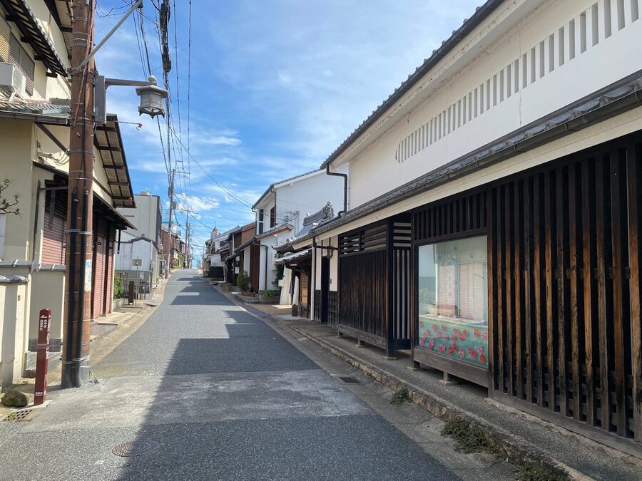 Charming street view in Kyoto with traditional Japanese wooden buildings under a clear sky