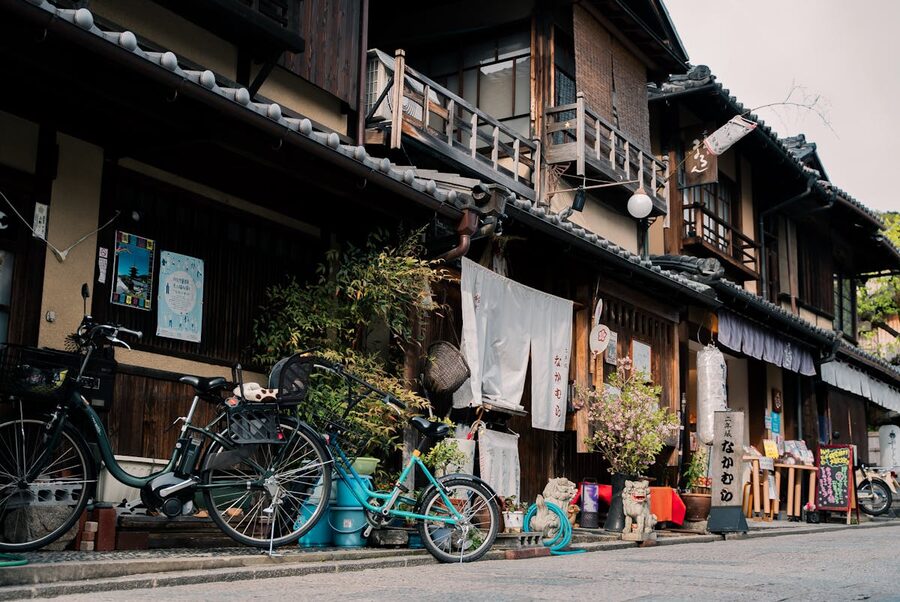 Charming Kyoto street with wooden buildings and bicycles parked outside