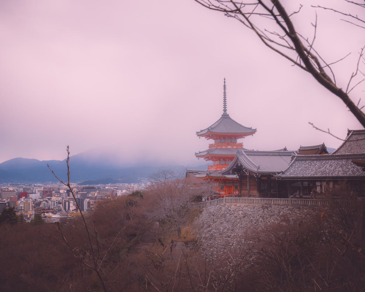 Kiyomizu-dera temple during a misty day with Kyoto cityscape in background