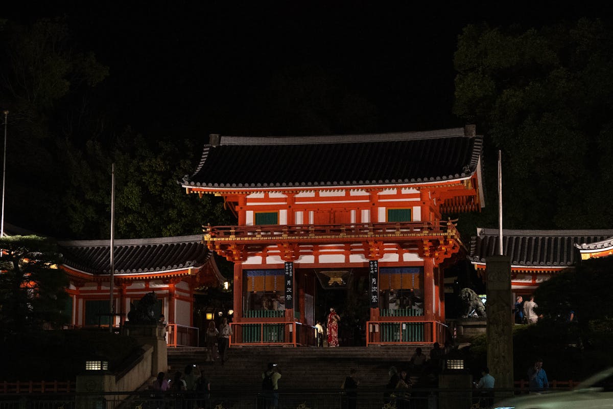 Illuminated entrance of Yasaka Shrine at night in Kyoto