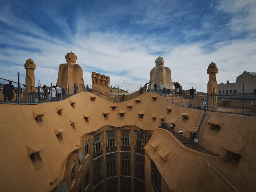 Warrior rooftop chimneys at La Pedrera Casa Mila against blue sky