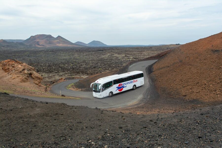Coach bus on Timanfaya National Park road Lanzarote