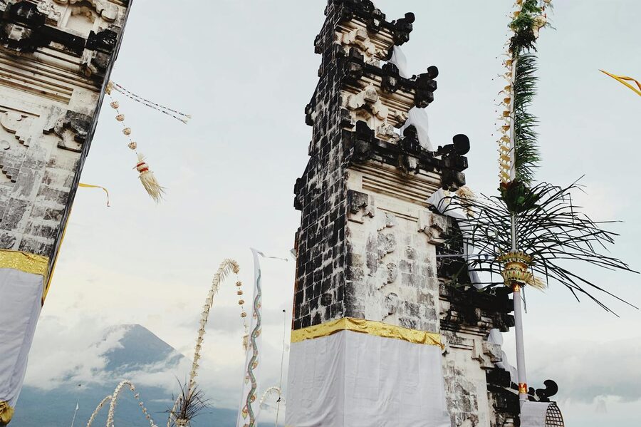 Traditional split gate of a Balinese temple with Mount Agung visible behind it