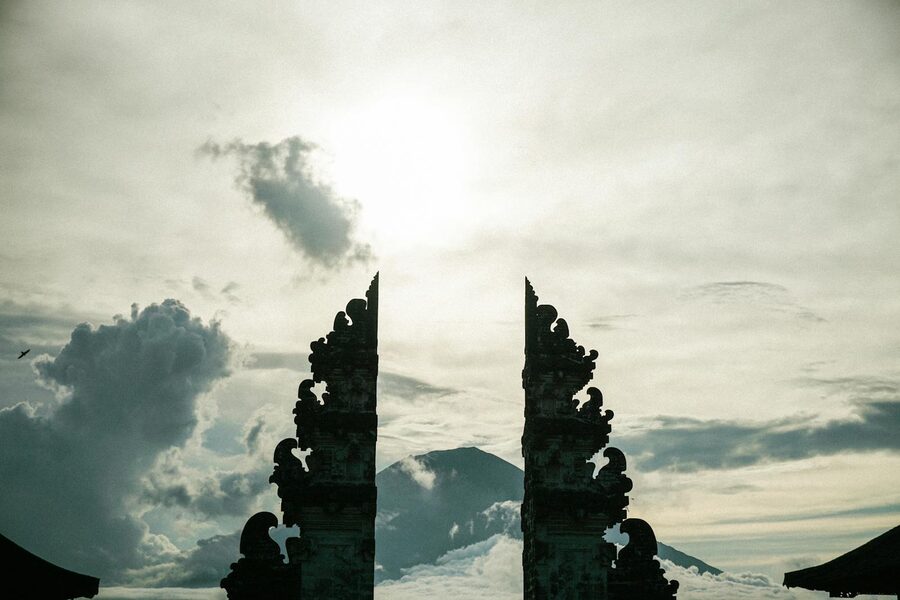 Silhouette of Pura Lempuyang's iconic split gate against a dramatic sky