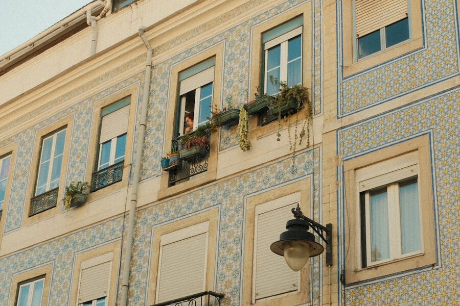 Azulejo blue and white tile facade with window Alfama Lisbon