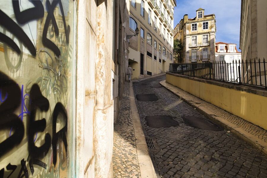 Narrow cobblestone Alfama street Lisbon Portugal