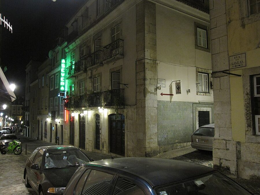 Bairro Alto Lisbon at night with lit street and cafes
