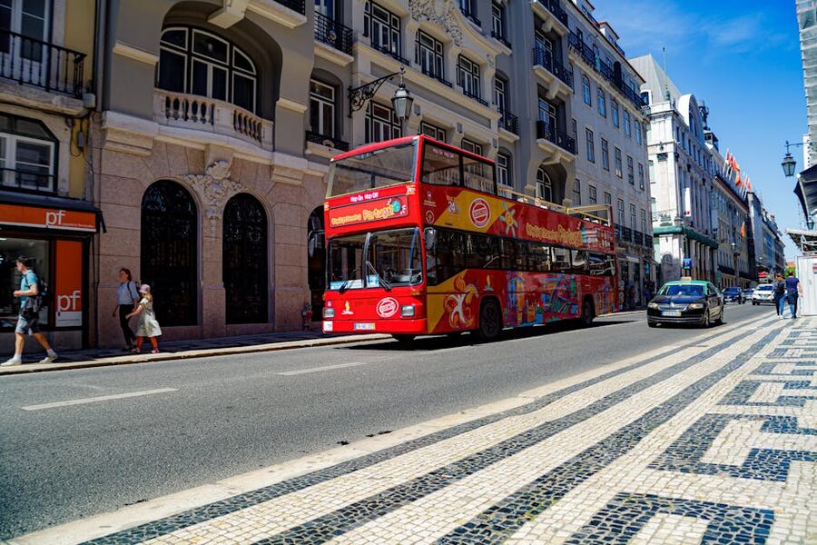 Lisbon hop-on hop-off double-decker bus on a city street