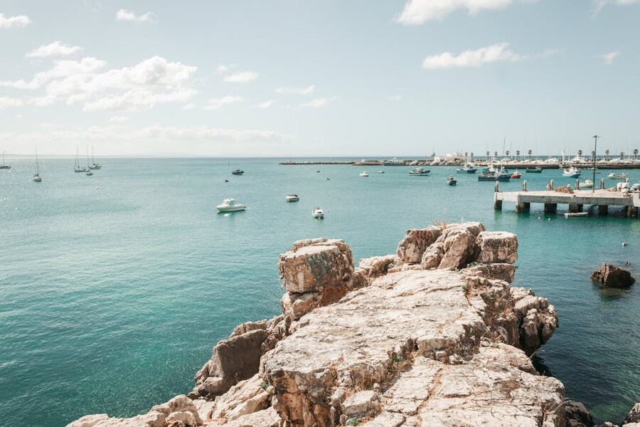 Cascais coast boats rocky shore Portugal