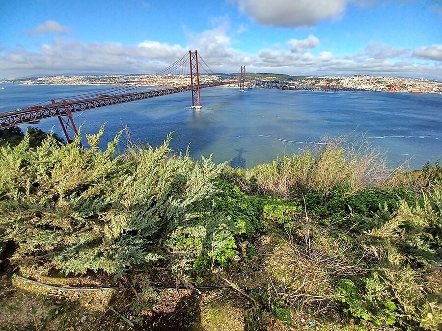 Cristo Rei statue at Almada with arms outstretched over the Tagus, Lisbon