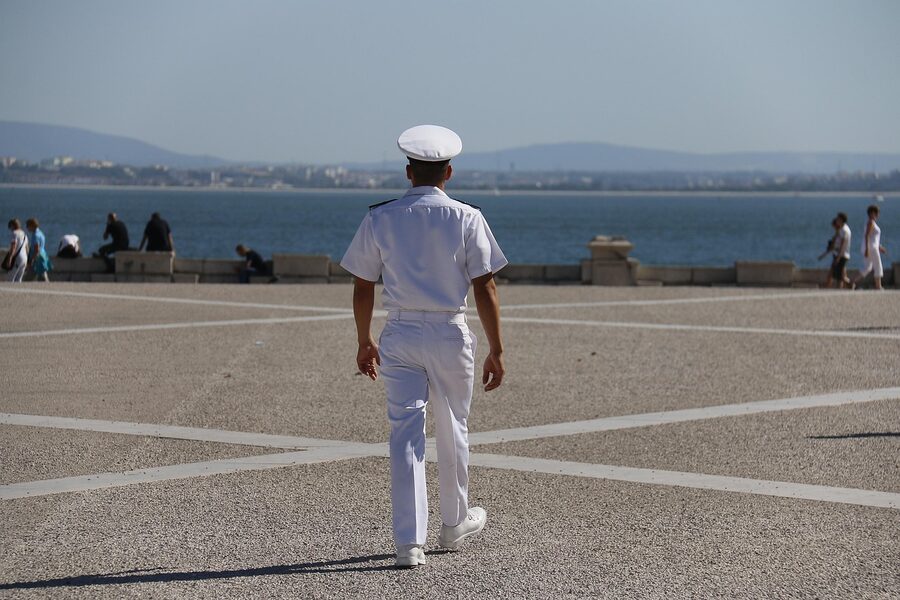 Crew member working on the deck of a Tagus river sailing boat, Lisbon
