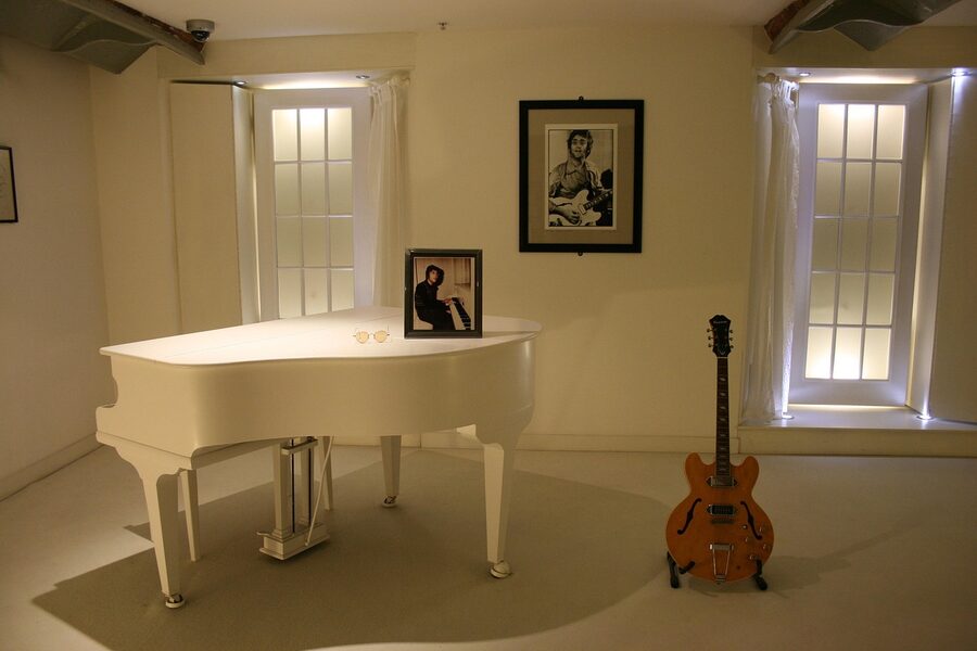 A replica of John Lennon's white Imagine piano on display
