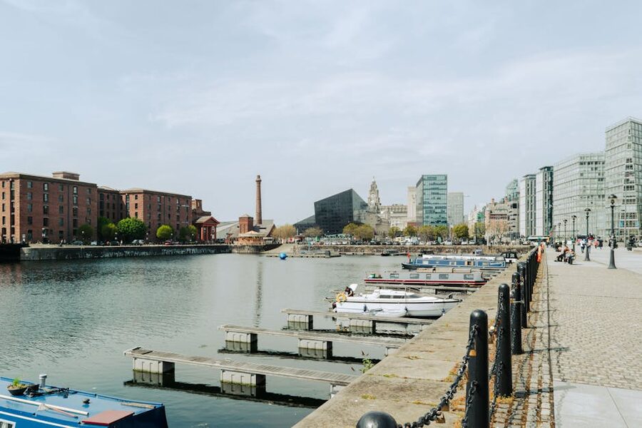 Boats moored at Royal Albert Dock Liverpool with red brick warehouses behind