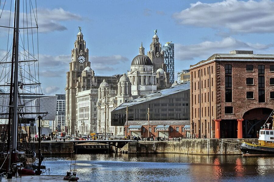 Liverpool Pier Head viewed from Royal Albert Dock with the Liver Building in the distance