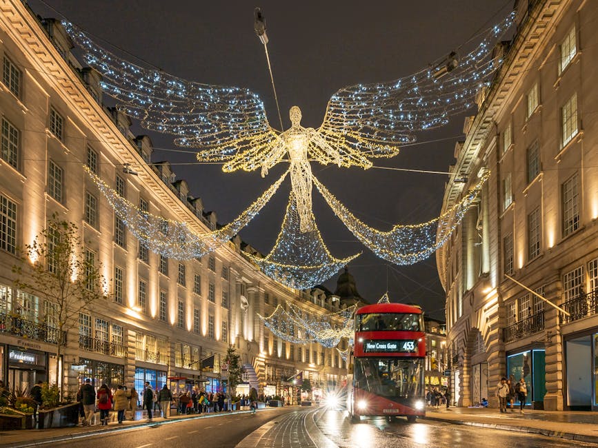 Regent Street angel light display with double-decker bus during Christmas