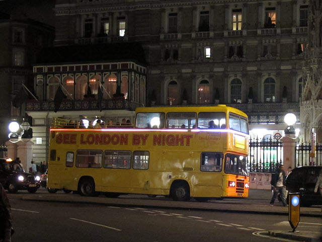 Seeing London by Night passengers on the open-top bus