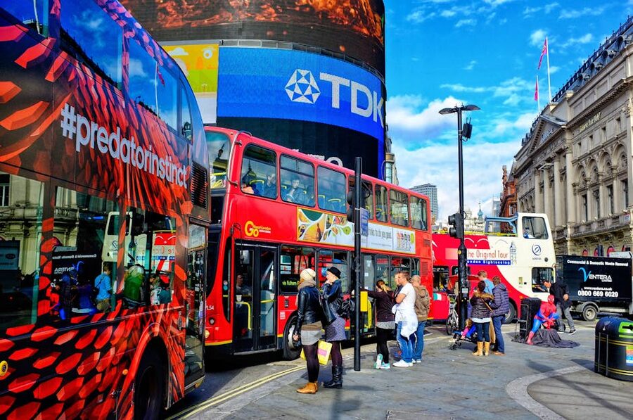 Double-decker buses and pedestrians at Piccadilly Circus