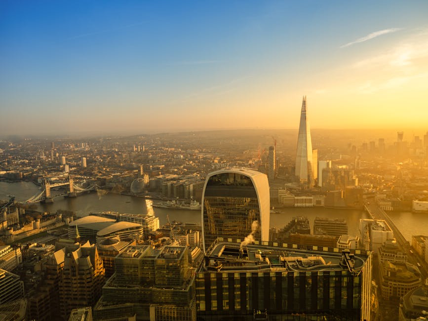 Aerial sunset view of London skyline with The Shard and Tower Bridge