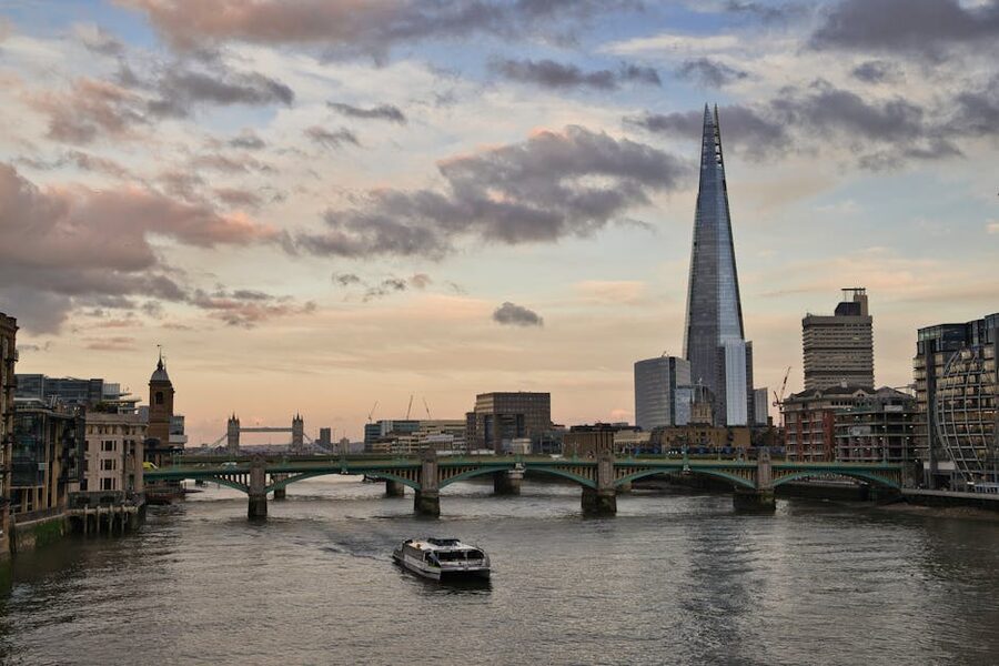 The Shard at sunset over a Thames bridge