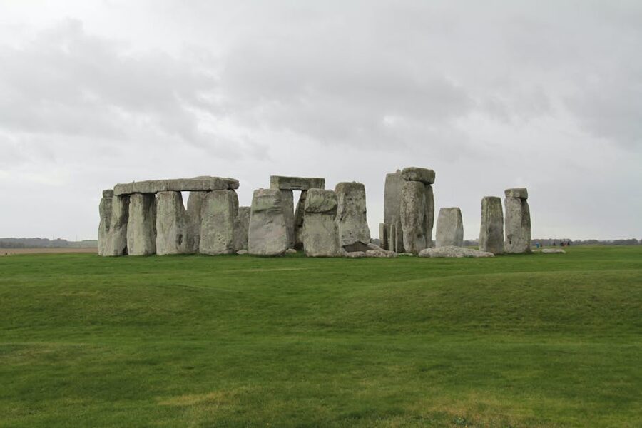 Stonehenge stone circle pathway under cloudy sky