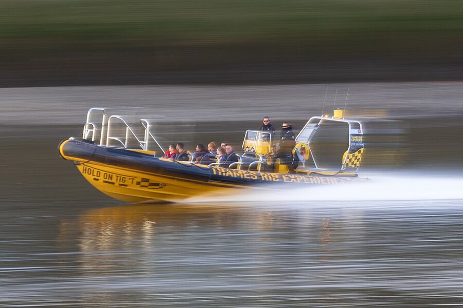 Speedboat blurred motion on Thames near Greenwich