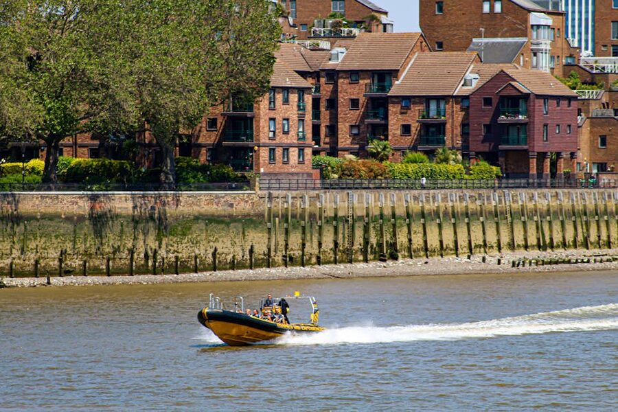 Speedboat cruising the River Thames in central London