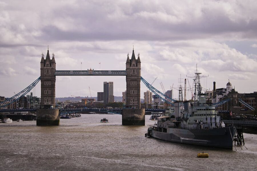 Tower Bridge over the River Thames under cloudy sky