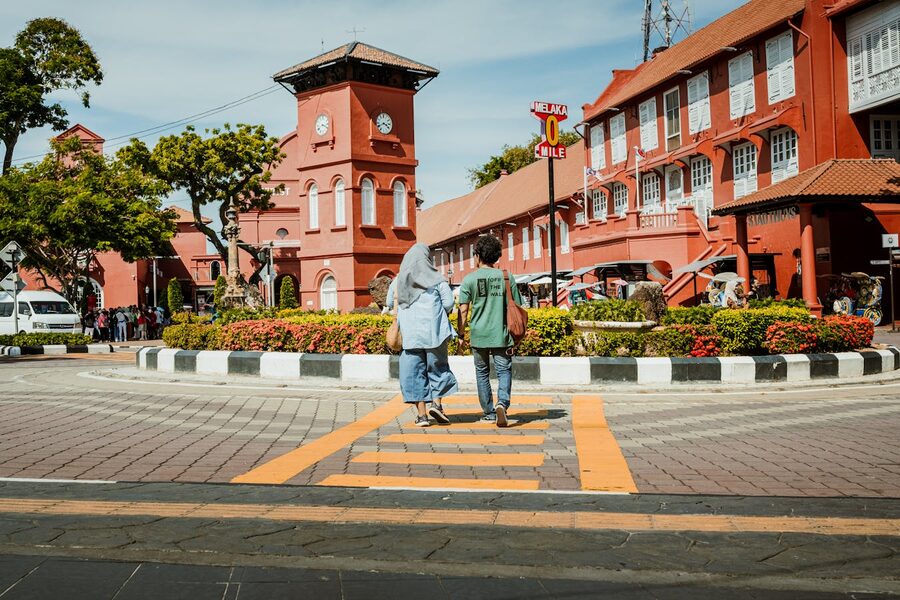Tourists walking through Dutch Square in Malacca