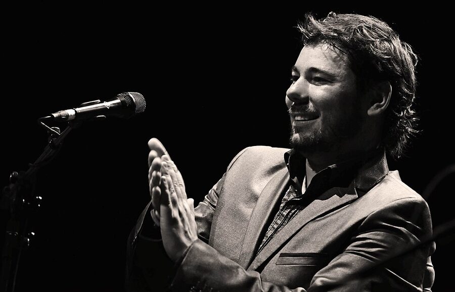 Flamenco cantaor singer performing on stage in Madrid