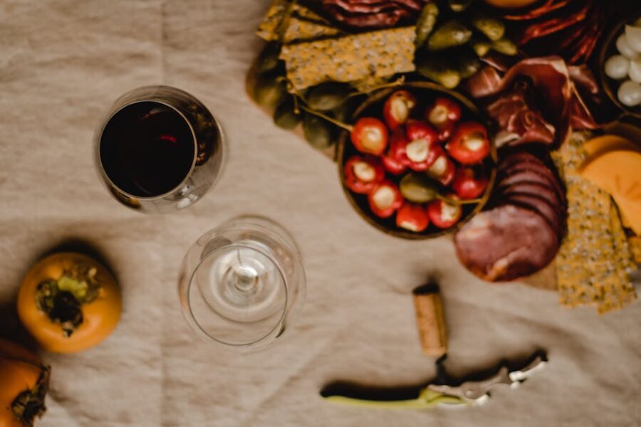 Glass of red wine and charcuterie board, Madrid pre-show
