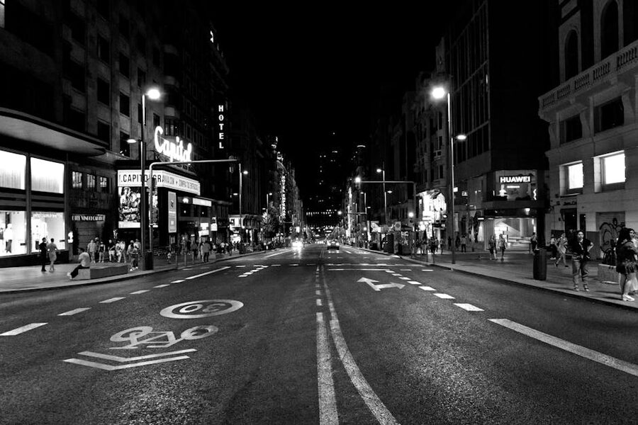 Gran Via in Madrid at night with neon signs