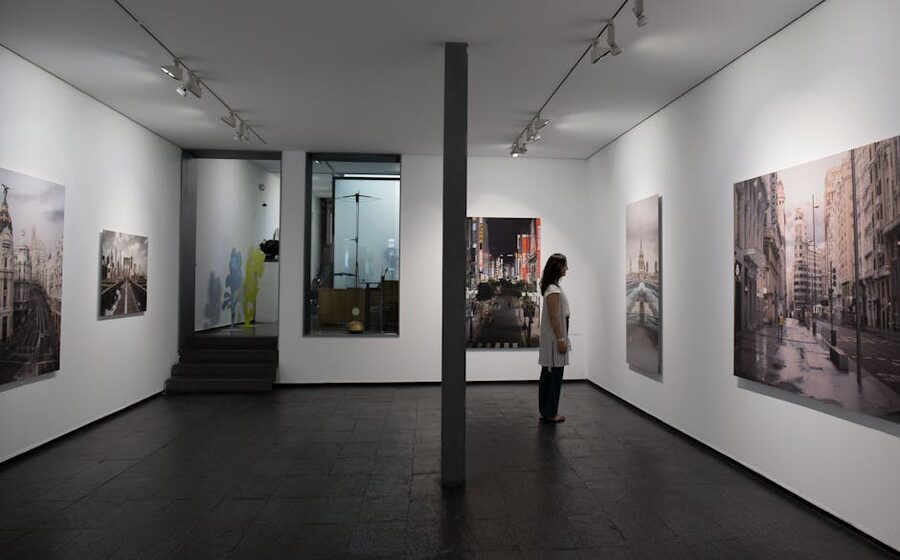 Visitor observing classical paintings in a Madrid art gallery