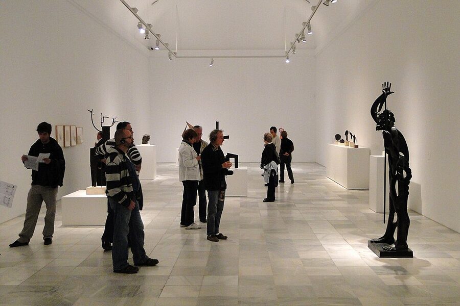 Reina Sofia gallery visitors viewing modern art on white walls