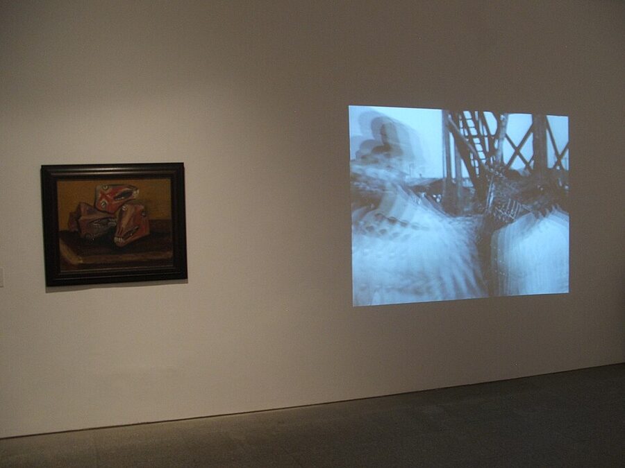 Reina Sofia gallery with painting and projected film side by side