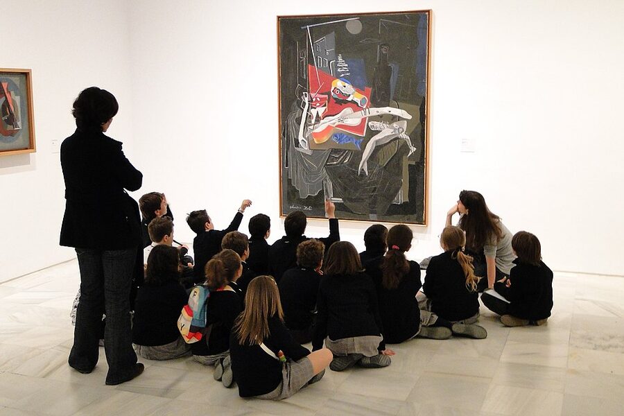 School group viewing abstract painting at Reina Sofia Madrid